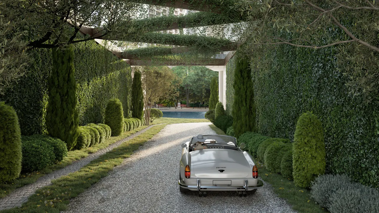 Gated arrival drive lined with tall hedges and topiary, with a classic convertible on gravel
