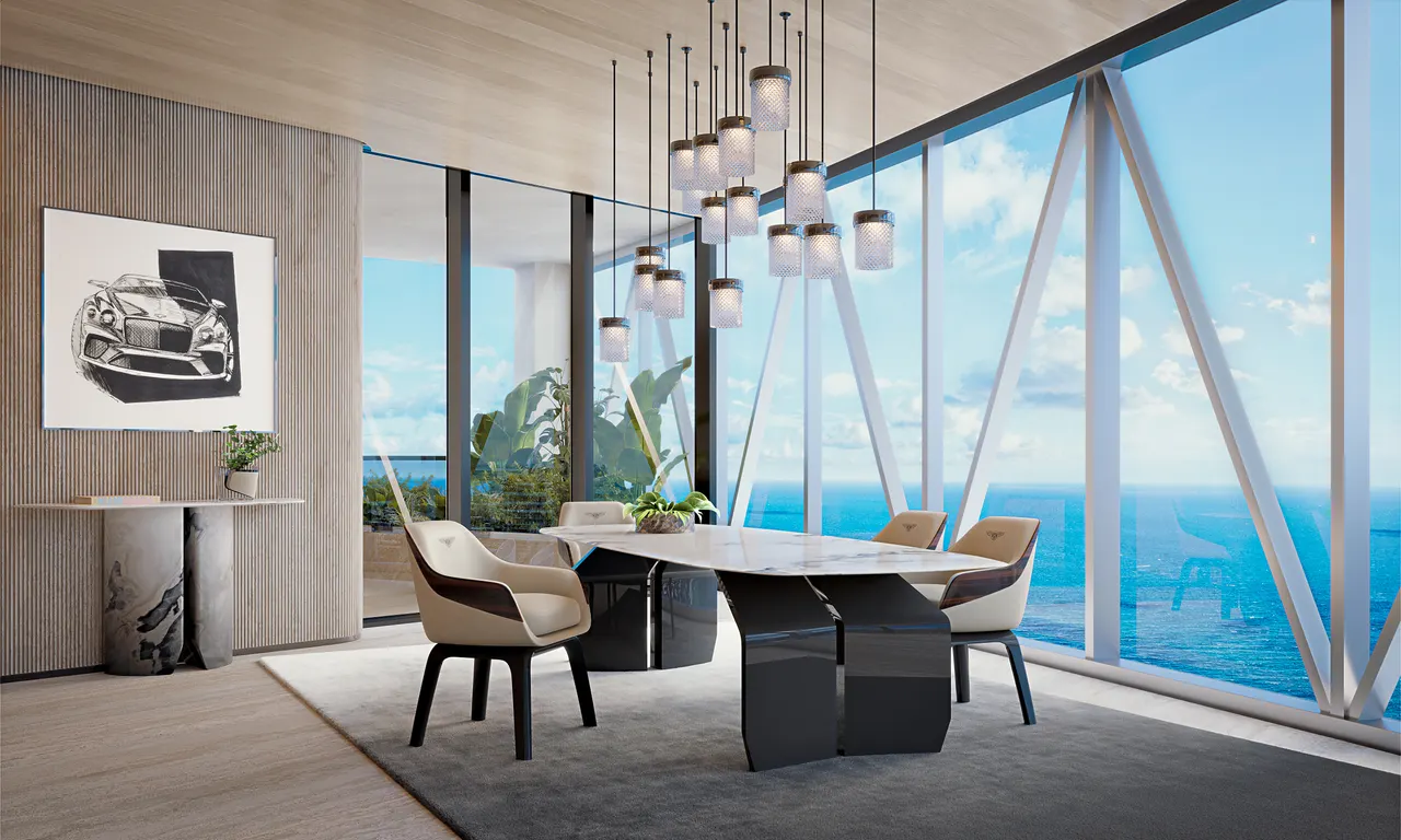 Dining area with marble table, cluster pendant lights and floor-to-ceiling windows over the ocean