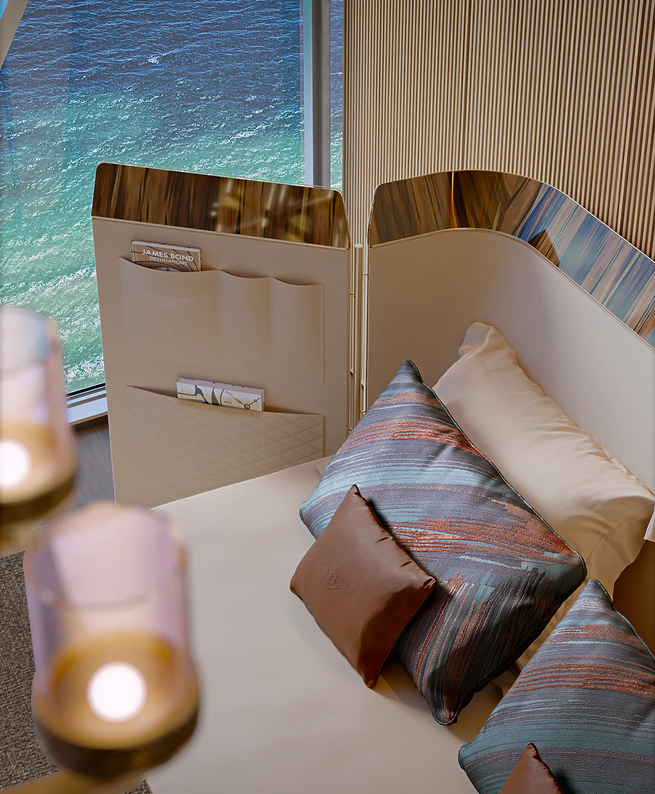 Built-in banquette with patterned cushions and wood paneling beside a window over the water