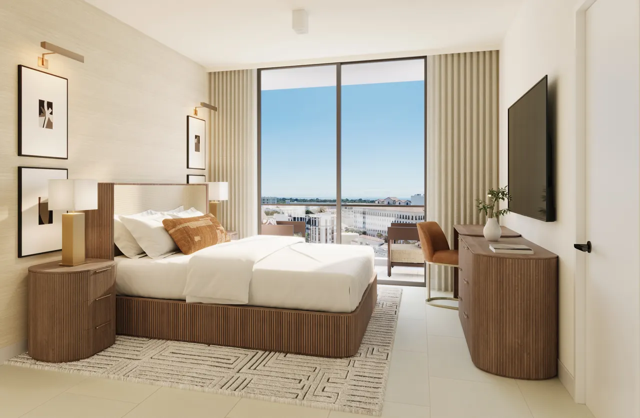 Bedroom with fluted wood bed and dresser, wall-mounted TV and floor-to-ceiling window to a balcony