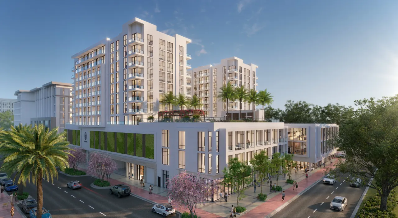 Aerial view of Cassia's white mid-rise towers above a landscaped retail podium and tree-lined streets