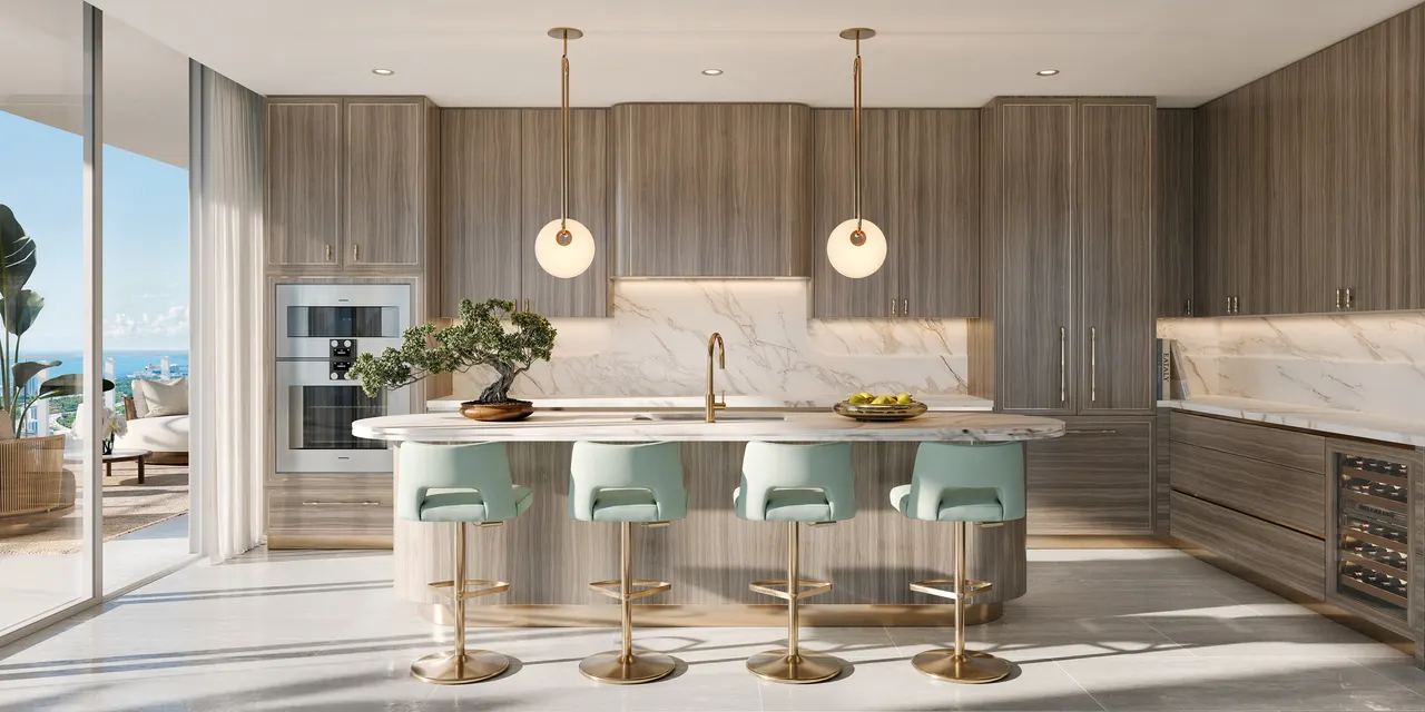 Kitchen with wood cabinetry, marble waterfall island, gold pendants and mint bar stools