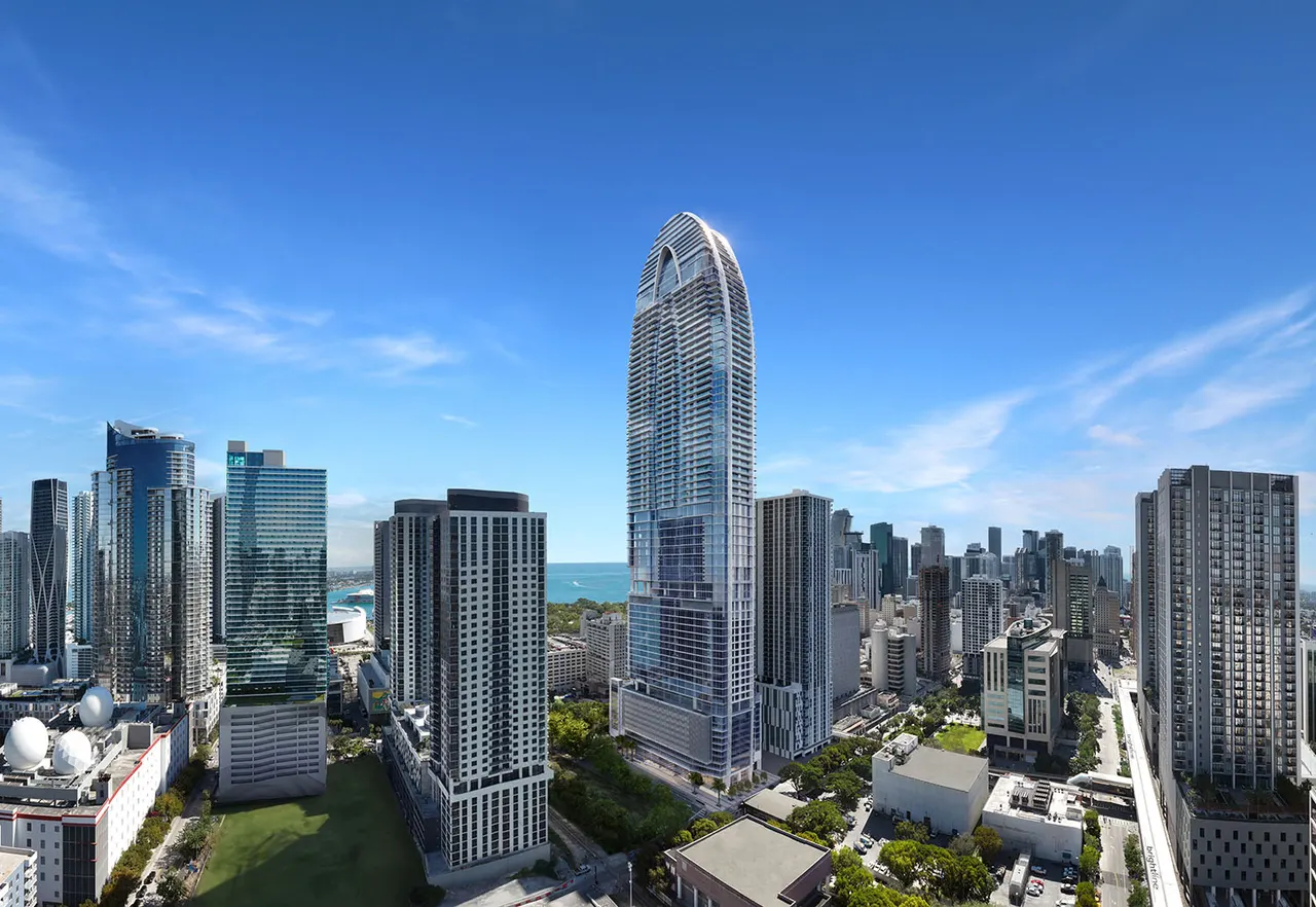 Okan Tower rising above the downtown Miami skyline with water visible in the distance