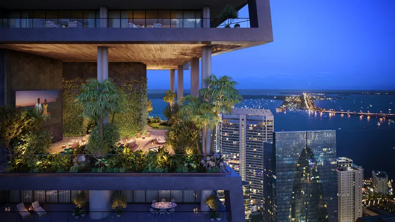 Elevated sky garden terrace with palms, lounge seating and outdoor screen above a lit city skyline at dusk