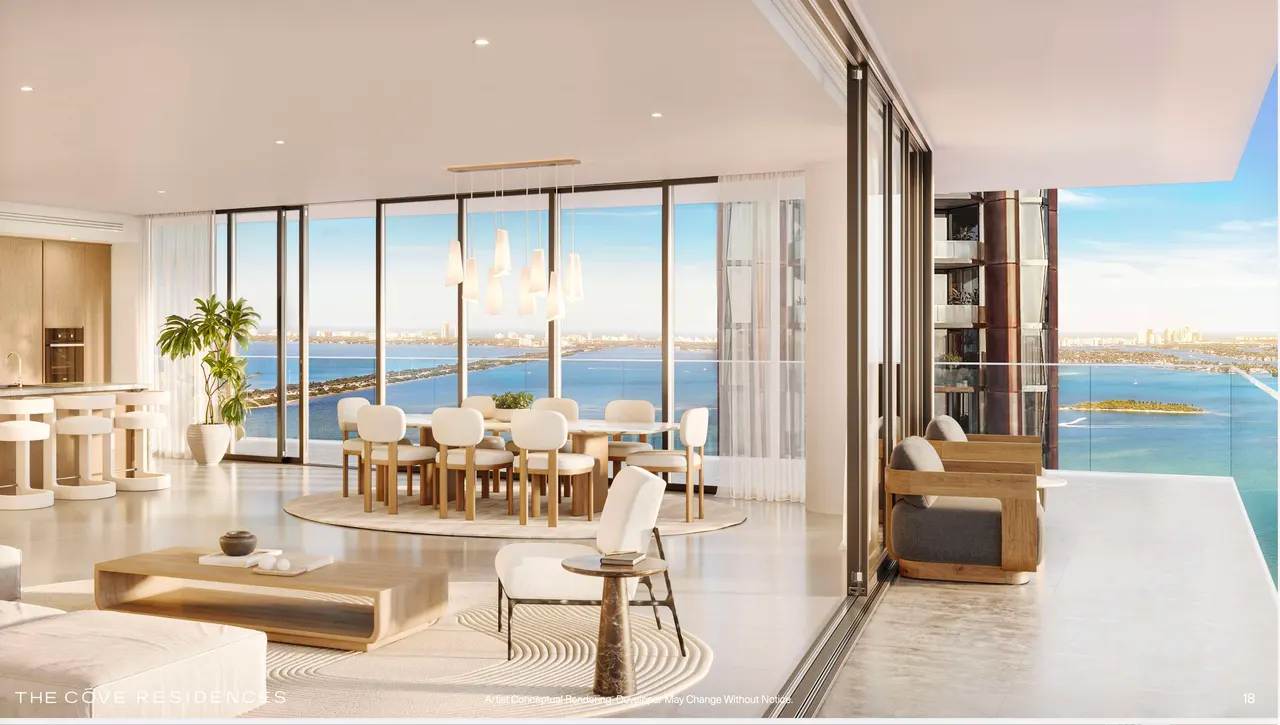 Open living and dining area with floor-to-ceiling glass, sliding doors to a terrace and water views