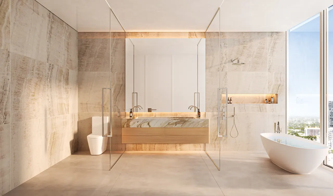 Primary bathroom with double vanity, glass-enclosed shower and freestanding tub by a full-height window