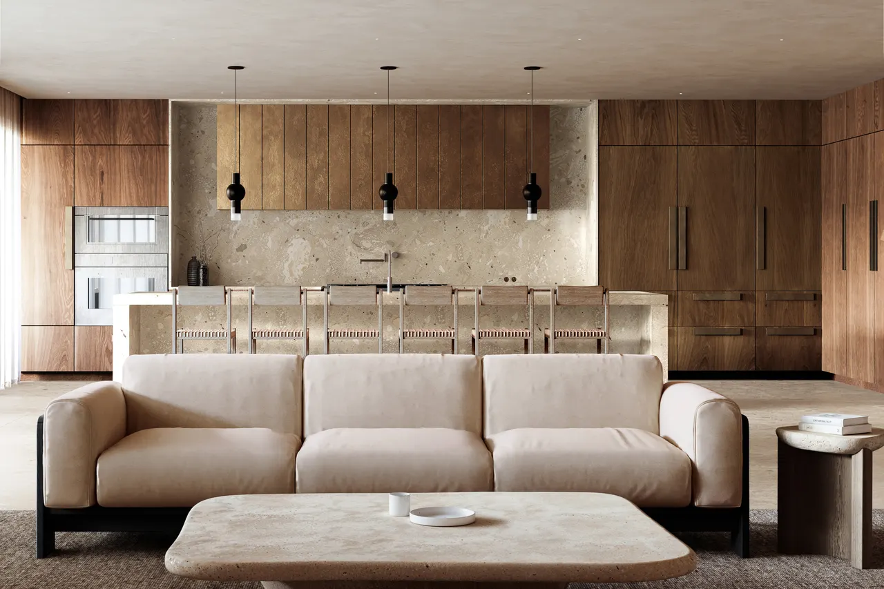 Open living area with beige sofa, stone coffee table and wood kitchen with island seating